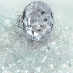 beautiful-large-diamond-engagement-wedding-ring-sitting-on-diamonds-scattered-background